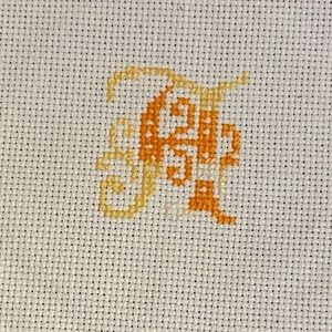 Orange and Yellow Cross-Stitch Monogram A